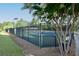 Community tennis courts surrounded by trees and manicured lawn are perfect for playing tennis at 2484 Mossy Branch Dr, Snellville, GA 30078