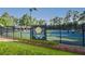 Bright Water community tennis courts surrounded by lush landscaping are perfect for tennis enthusiasts at 2484 Mossy Branch Dr, Snellville, GA 30078