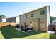 Spacious backyard featuring a well-maintained lawn, patio, seating, and grill area at 3537 Edenridge Ct, Buford, GA 30519