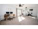 Spacious bedroom with a desk, chair, and natural light at 3537 Edenridge Ct, Buford, GA 30519
