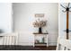 Dining room featuring a dark wood table, light blue walls, and coat rack near the entrance at 3537 Edenridge Ct, Buford, GA 30519