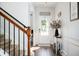 Inviting foyer with stylish decor, wood floors, and a staircase at 3537 Edenridge Ct, Buford, GA 30519