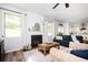 Open concept living room with fireplace and seamless flow to the adjacent kitchen at 3537 Edenridge Ct, Buford, GA 30519