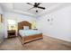 Relaxing main bedroom with tray ceilings, large windows, and a cozy bed at 3537 Edenridge Ct, Buford, GA 30519
