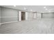 An expansive finished basement with vinyl floors, recessed lights, and modern trim at 5060 Winship Ct, Alpharetta, GA 30009