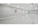 A finished basement with vinyl floors, trim, and recessed lighting at 5060 Winship Ct, Alpharetta, GA 30009