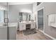 Elegant bathroom featuring a double vanity, shower, and hardwood floors at 5060 Winship Ct, Alpharetta, GA 30009
