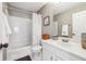 A standard bathroom featuring a tub shower combination and single vanity at 5060 Winship Ct, Alpharetta, GA 30009
