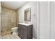 Updated bathroom featuring a walk-in shower, modern vanity, and neutral color palette at 5060 Winship Ct, Alpharetta, GA 30009