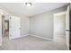 Neutral bedroom with gray walls, carpet, closet, and doors at 5060 Winship Ct, Alpharetta, GA 30009