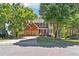 Charming two-story house with a lush green lawn, mature trees, and two-car garage, a picturesque suburban setting at 5060 Winship Ct, Alpharetta, GA 30009