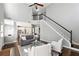 Bright living area with soaring ceilings, hardwood floors, staircase, and open view to the kitchen at 5060 Winship Ct, Alpharetta, GA 30009