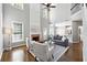 Inviting living room boasts a fireplace, soaring ceilings, large windows, and hardwood floors at 5060 Winship Ct, Alpharetta, GA 30009