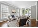 Bright living room with a bay window, modern furniture, hardwood floors, and neutral decor for a cozy feel at 5060 Winship Ct, Alpharetta, GA 30009