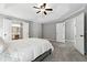 Expansive main bedroom featuring a tray ceiling and connecting bathroom at 5060 Winship Ct, Alpharetta, GA 30009