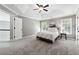 Spacious main bedroom with trey ceilings, plush carpet, and lots of natural light at 5060 Winship Ct, Alpharetta, GA 30009