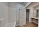 The bathroom featuring vinyl floors, a shower, and a vanity at 514 Jadetree Ln, Atlanta, GA 30349
