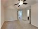 Bedroom featuring carpeted floors, closet doors, and a ceiling fan at 514 Jadetree Ln, Atlanta, GA 30349