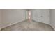 Bedroom featuring carpeted floors, closet, baseboard trim, and neutral colored walls at 514 Jadetree Ln, Atlanta, GA 30349