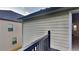 View from the deck looking into the home with siding and railings at 514 Jadetree Ln, Atlanta, GA 30349