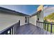 View from the deck looking into the home with siding and railings at 514 Jadetree Ln, Atlanta, GA 30349