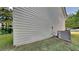 Exterior features horizontal siding, green grass, and the HVAC unit at 514 Jadetree Ln, Atlanta, GA 30349