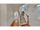 The foyer features staircase, hardwood floors, and views to multiple rooms in the house at 514 Jadetree Ln, Atlanta, GA 30349