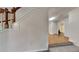 Hallway with hardwood floors leading to a bathroom, showcasing the home's layout at 514 Jadetree Ln, Atlanta, GA 30349