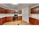 Bright kitchen featuring stainless steel appliances, abundant cabinet space, and sleek countertops at 514 Jadetree Ln, Atlanta, GA 30349