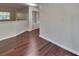 View of the living room with hardwood floors leading to another room at 514 Jadetree Ln, Atlanta, GA 30349