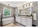 Elegant bathroom features a soaking tub, double vanity, and modern lighting at 5860 Riverwood Dr, Sandy Springs, GA 30328
