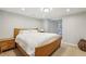 Bedroom featuring carpet, neutral paint, and a comfortable queen sized bed at 5860 Riverwood Dr, Sandy Springs, GA 30328