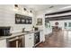 Coffee bar featuring granite counters, mini fridge, and decorative lighting at 5860 Riverwood Dr, Sandy Springs, GA 30328