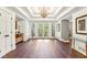 Bright and spacious foyer with hardwood floors and detailed ceiling design at 5860 Riverwood Dr, Sandy Springs, GA 30328