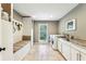 Bright laundry room features a washer and dryer, granite countertops, and a cozy bench with storage at 5860 Riverwood Dr, Sandy Springs, GA 30328