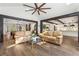 Bright living room with exposed beams, skylights, and views to the kitchen at 5860 Riverwood Dr, Sandy Springs, GA 30328