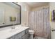 Bathroom featuring a framed mirror, modern vanity, shower-tub combination, and neutral walls at 855 Lakeside Cir, Covington, GA 30016