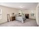 Comfortable bedroom featuring carpet, two windows, and classic wooden furniture at 855 Lakeside Cir, Covington, GA 30016