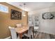 Cozy dining area featuring a wooden table with seating for four and stylish wall decor at 855 Lakeside Cir, Covington, GA 30016