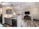 Modern kitchen featuring stainless steel appliances, white countertops, and wood-look flooring at 855 Lakeside Cir, Covington, GA 30016