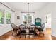 Elegant dining room featuring hardwood floors, large windows, and a classic dining set at 132 Olympic Pl, Decatur, GA 30030