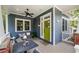 Cozy front porch with seating and a swing, perfect for relaxing outdoors at 132 Olympic Pl, Decatur, GA 30030