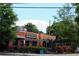 Exterior view of Universal Joint featuring outdoor seating area, signage, and landscaping at 132 Olympic Pl, Decatur, GA 30030
