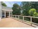 Outdoor deck featuring a screened-in porch with a fireplace and backyard views at 402 Lake Point Trce, Canton, GA 30114