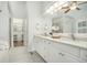 Bright bathroom featuring dual sinks, white cabinets, and modern fixtures at 402 Lake Point Trce, Canton, GA 30114