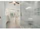 Bathroom showcases a shower and tub with luxurious marble tile at 402 Lake Point Trce, Canton, GA 30114