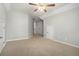 Serene bedroom boasts plush carpet and abundant natural light at 402 Lake Point Trce, Canton, GA 30114