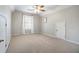 Inviting bedroom features neutral carpet and soft, natural light at 402 Lake Point Trce, Canton, GA 30114