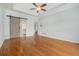Spacious bedroom featuring hardwood floors and a sliding barn door to the bath at 402 Lake Point Trce, Canton, GA 30114