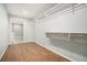 Spacious walk-in closet with wood floors and shelving at 402 Lake Point Trce, Canton, GA 30114